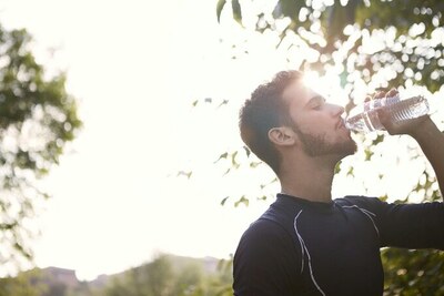 A man drinking water.