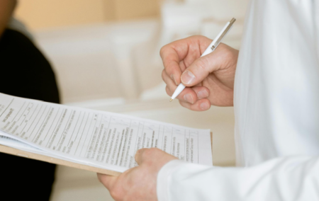 A doctor looking at a patient’s results